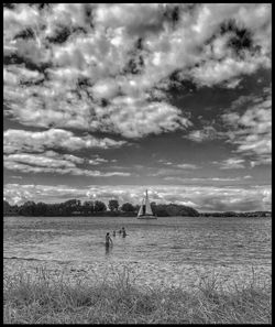 Scenic view of landscape against cloudy sky