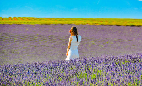 Full length of woman standing on field