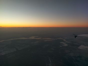 Scenic view of sea against clear sky during sunset