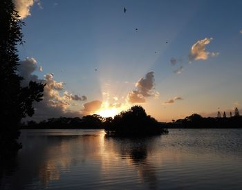 Scenic view of lake against sky during sunset