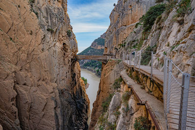 Panoramic view of bridge over rocky mountains