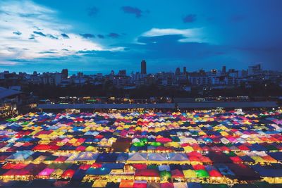 Multi colored cityscape against sky