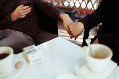 Cropped image of hand holding outdoors