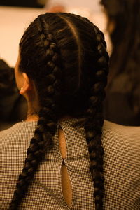 Rear view of woman with braided hair