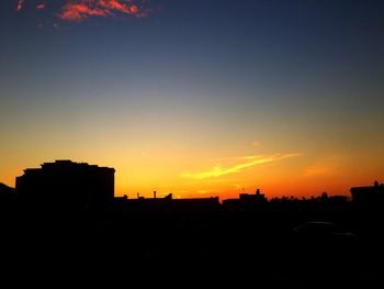 Silhouette of building at sunset