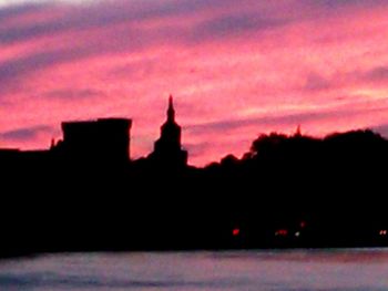 Built structures against sky at dusk