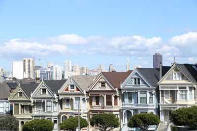 Houses in city against sky