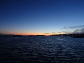 Scenic view of sea against sky at night