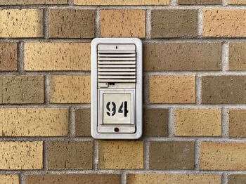 Close-up of text on brick wall