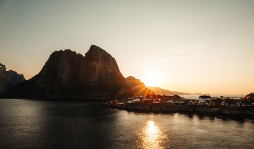 Scenic view of lake against sky during sunset
