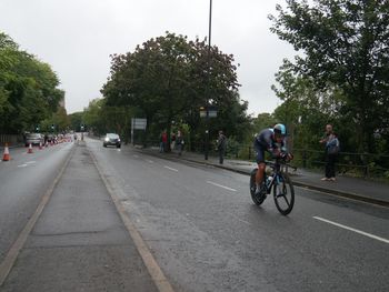 People riding bicycle on road