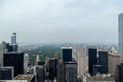 High angle view of buildings in city against sky