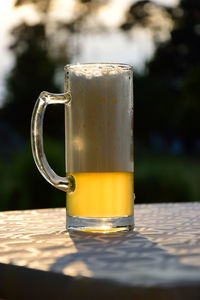 Close-up of beer glass on table
