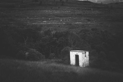 Abandoned building on field