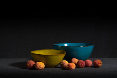 Close-up of fruits in bowl on table