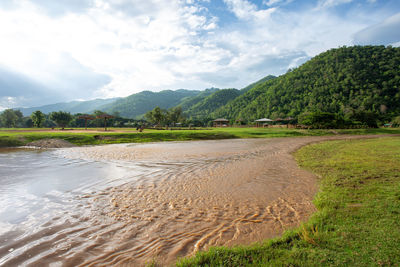 Scenic view of land against sky