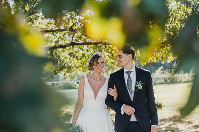 Cheerful couple walking at park