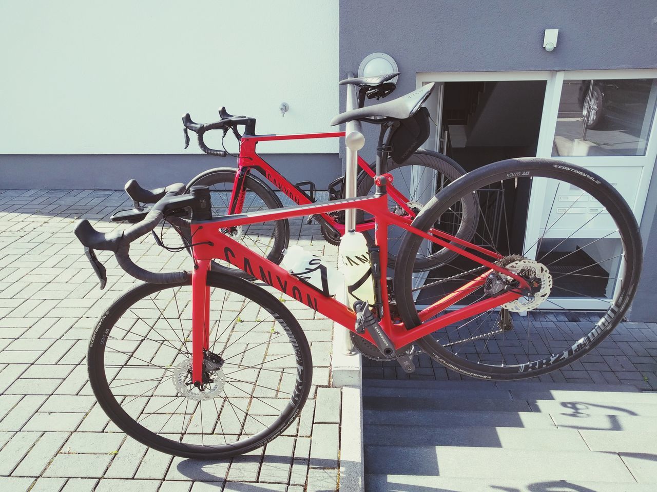 bicycle, land vehicle, stationary, transportation, mode of transport, day, outdoors, red, no people, bicycle rack, architecture