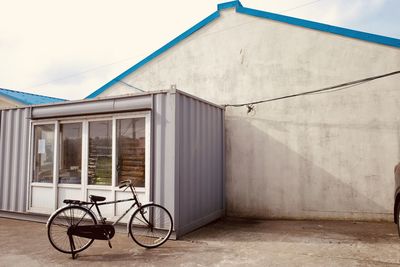 Bicycle parked against wall
