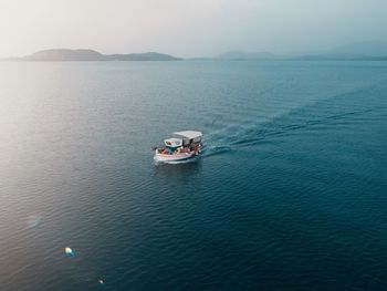 High angle view of boat sailing in sea against sky