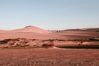 Scenic view of desert against clear sky