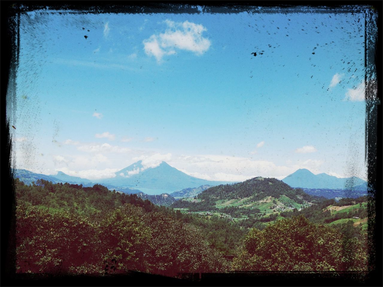 transfer print, mountain, auto post production filter, landscape, tranquil scene, sky, scenics, mountain range, tranquility, beauty in nature, nature, cloud - sky, non-urban scene, cloud, blue, idyllic, hill, horizon over land, day, non urban scene