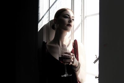 Elegant woman with glass of wine