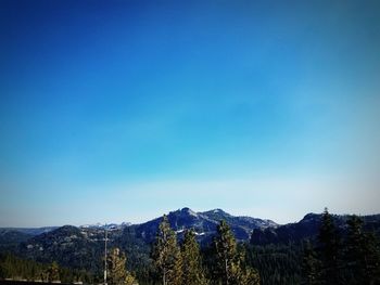 Scenic view of mountains against clear blue sky