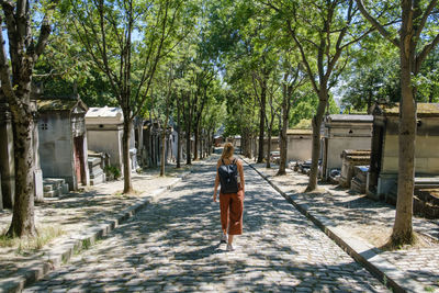 Rear view of woman walking on street