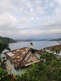 High angle view of houses and buildings against sky