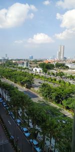 High angle view of trees and buildings against sky