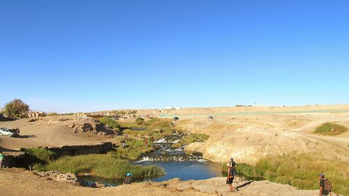 Scenic view of landscape against clear blue sky