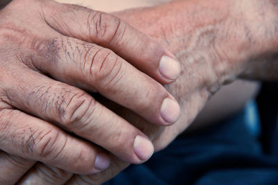 Cropped image of senior man with hands clasped