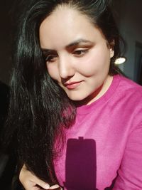 Portrait of teenage girl using smart phone at home