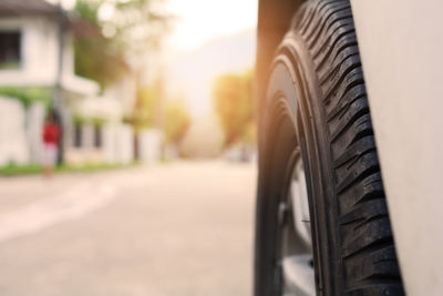 Close-up of black car on road