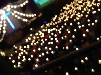 Defocused image of illuminated city at night