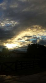 Scenic view of landscape against cloudy sky