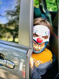 Close-up of child in car