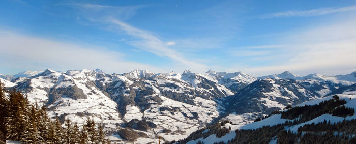 Scenic view of snow covered mountains against sky