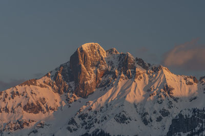 Scenic view of snowcapped mountains against clear sky