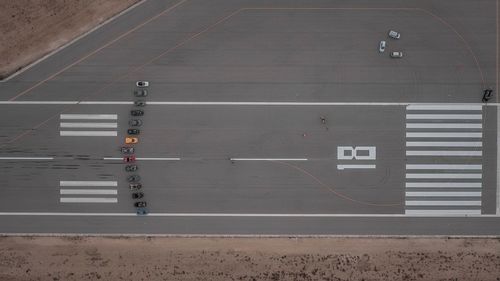 Aerial view of arrow cars on road