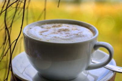 Close-up of coffee cup on table