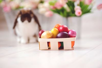 Close-up of easter eggs with bubby in background on table