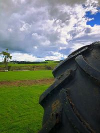 Abandoned airplane on field against sky