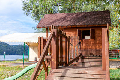 Exterior of house by building against sky