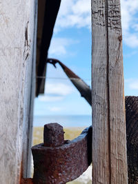 Close-up of wooden fence against sky