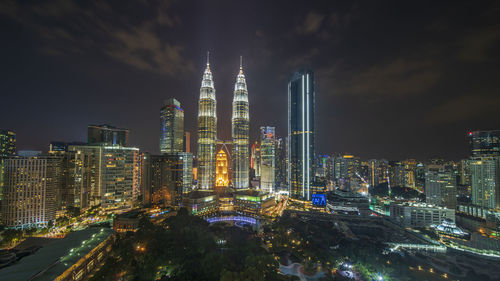 Illuminated buildings in city at night