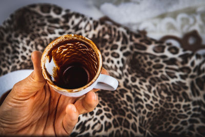 Midsection of person holding coffee