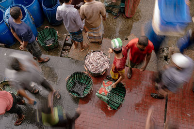 High angle view of people working at workshop