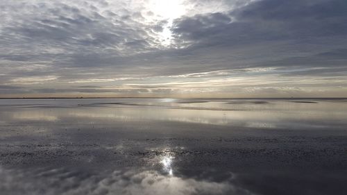 Scenic view of sea against sky at sunset